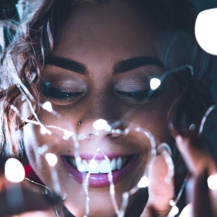 Alexandra Reed, Lead Design Curator at FoxRunBox, reviewing corporate floral arrangements